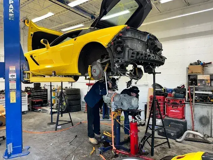 Beach Auto & Transmission Repair technician servicing a transmission on a lifted sports car in our Virginia Beach shop