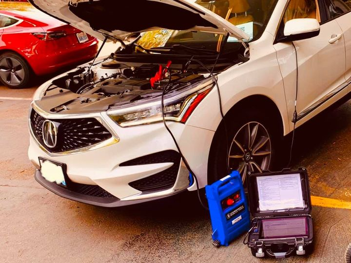 White Acura SUV with the hood open connected to diagnostic equipment at Beach Auto Repair in Virginia Beach