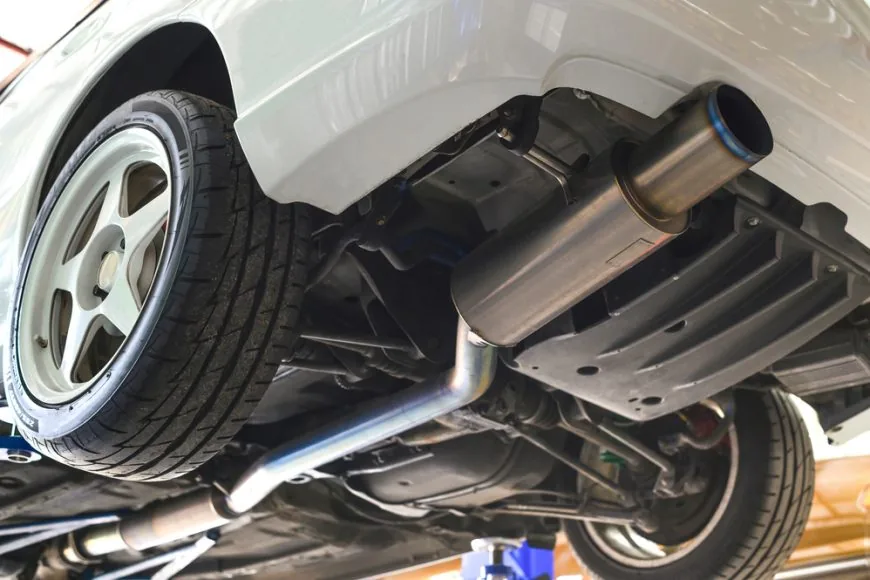 Performance cat-back aftermarket exhaust system installed on a vehicle at Beach Auto Repair