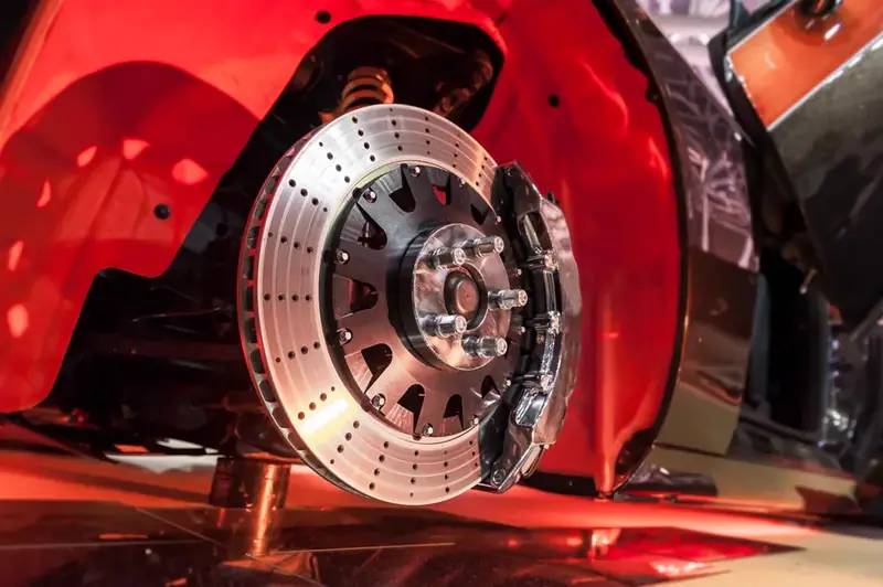 Brake pads and rotors being inspected during a free brake check at Beach Auto Repair