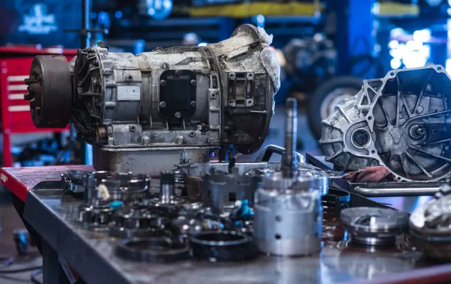 Transmission system being serviced with fluid change at Beach Auto Repair
